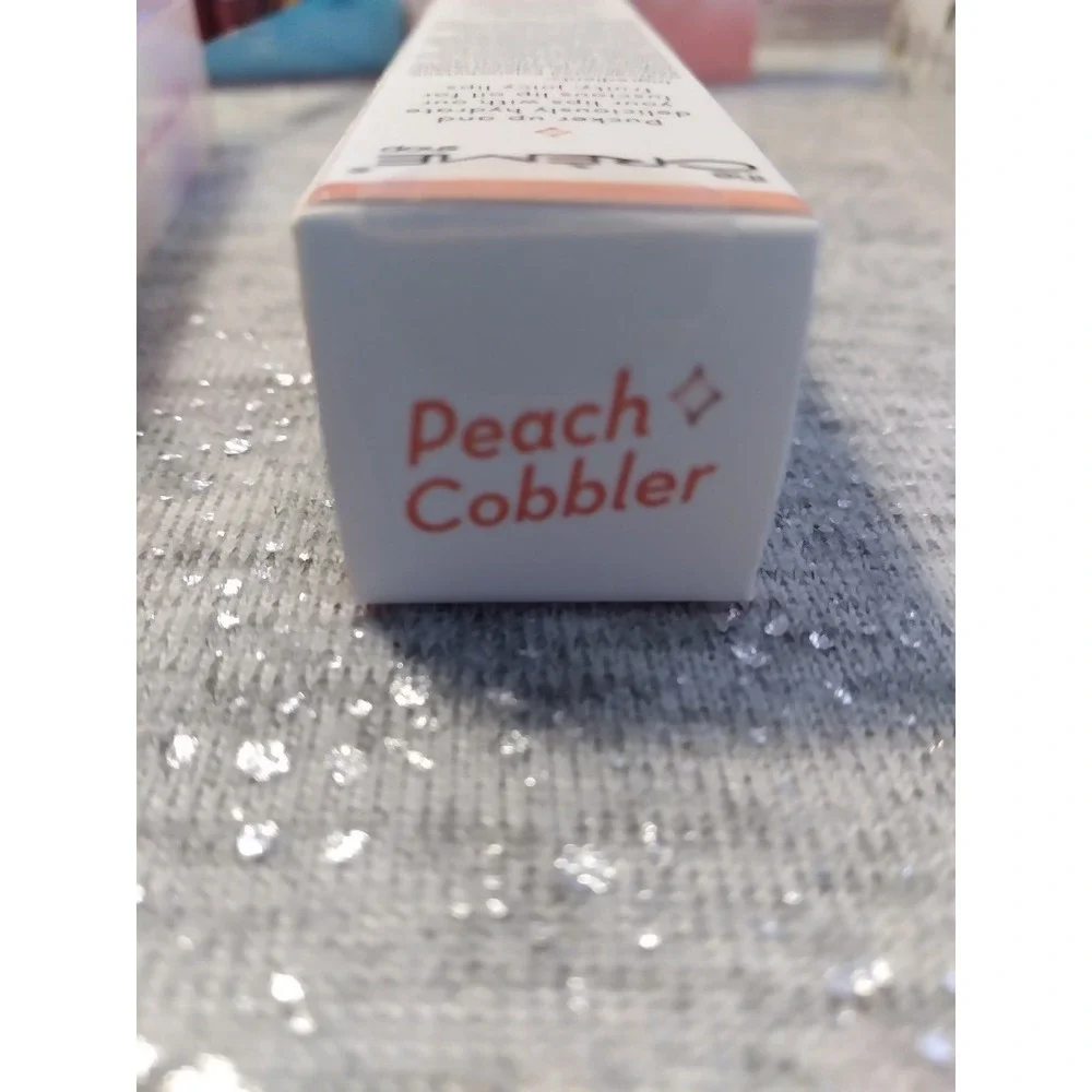 The Creme Shop Luscious Lip Oil Peach Essense Jojoba Oil Coconut Oil .12 OZ/3.4g